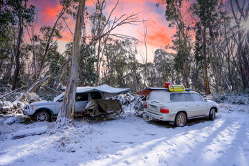 snow covered camp in swags in the high country
