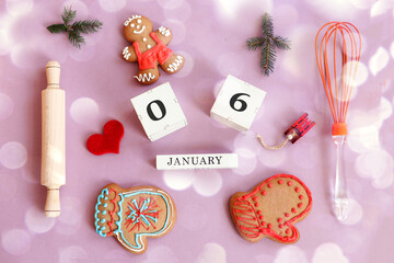 Calendar for January 6: name of the month in English, cubes with numbers 0 and 6, gingerbread men,...