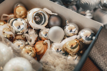 Obraz premium Box with bright glass Christmas balls close-up.