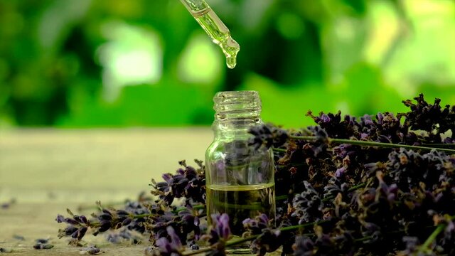 Lavender essential oil in a bottle. Selective focus.