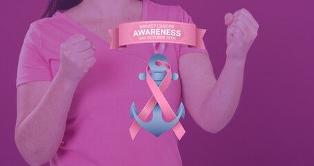 Composition of woman with clenched fists and breast cancer awareness slogan over purple background