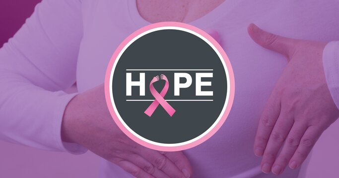 Composite image of woman with breast cancer awareness ribbon and hope text