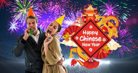 Portrait of couple blowing party horn by chinese new year text against firework