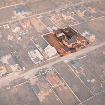 Cottage with land plot for Sale or Rent: Template for Land sales and Rent promotion. Roof Top aerial View of cottage with a land Plot on a haze overlay. Text copy space for Sign on the overlay.