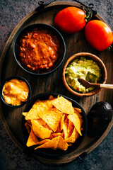 Mexican nachos with guacamole, cheddar cheese and chili.