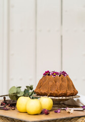Still life with an apple sponge cakes.
