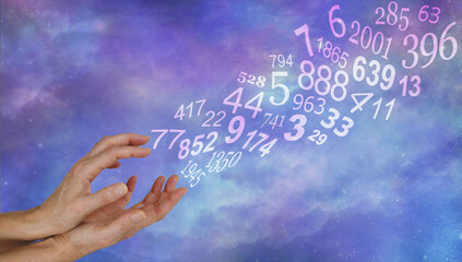 Numerology can provide guidance - cupped hands with a flow of random numbers floating off upwards against a celestial sky background with copy space for messages 
