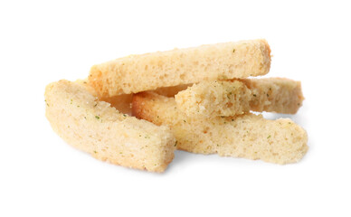 Heap of crispy rusks with seasoning on white background