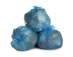 Fototapeta premium Blue trash bags filled with garbage on white background