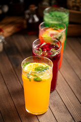 Various assorted glasses of different fruit lemonades