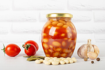 canned beans in tomato paste in a glass jar