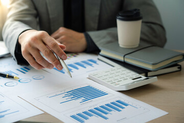 Close up view of bookkeeper or financial inspector hands making report, calculating or checking balance. Home finances, investment, economy, saving money or insurance concept.