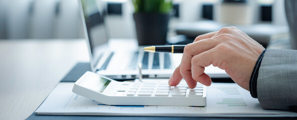 Close up view of bookkeeper or financial inspector hands making report, calculating or checking balance. Home finances, investment, economy, saving money or insurance concept.