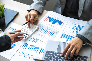 Analyzing results, Businessman accountant or financial expert analyze business report graph and finance chart at the corporate office. Concept of finance economy, banking business, and stock market