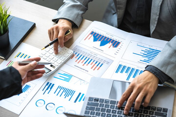 Analyzing results, Businessman accountant or financial expert analyze business report graph and...