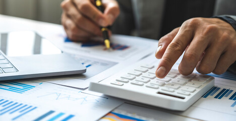 Business accounting concept, Business man using calculator with computer laptop, budget and loan...