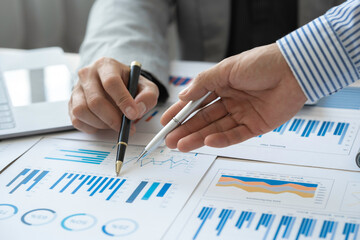 Analyzing results, Businessman accountant or financial expert analyze business report graph and...