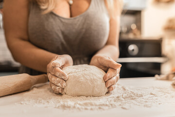 hands kneading dough