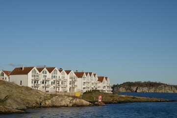 Fototapeta na wymiar Scenic cityscape of modern norwegian town. Modern white architecture of Stavanger. Sunny day. Lusefjord.