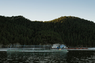 Obraz premium Nets and equipment for industrial fishing on a fjord in Norway.