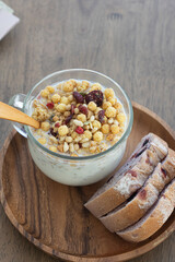 Breakfast with cereal in milk and bread.