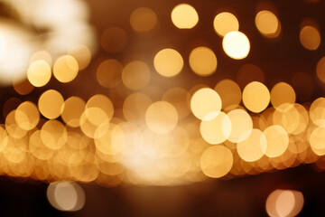 Christmas gold background. Festive abstract background with bokeh defocused lights