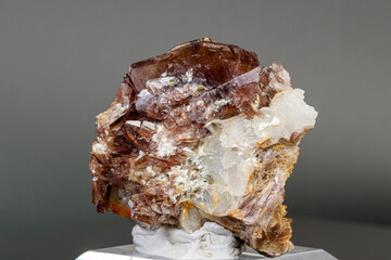 Macro minerals Axinite stone on a gray background