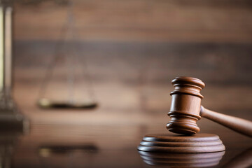 Judge office. Law and justice symbols composition: judge’s gavel, scale and Themis sculpture.