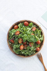 sprout vegetables salad with Tomatoes in Wood Bowl.