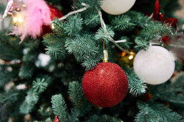 New Year decoration. Beautiful red and white balls on the Christmas tree