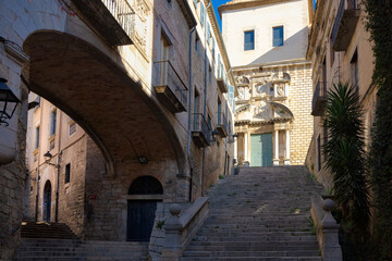 View of the streets of the historic center of Girona that go up to the church of San Marti, Catalonia, Spain
