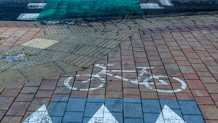 Bicycle path passing through the pedestrian crossing. Road Bike detail. Pedestrian crossing with bicycle lane.
