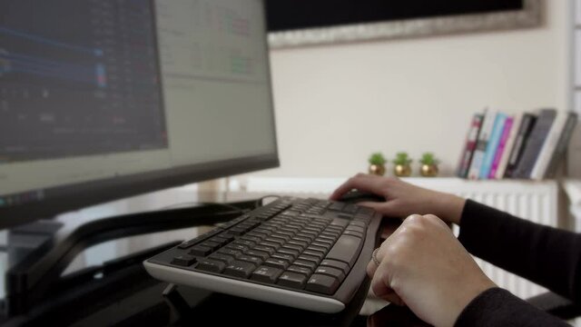 This stock footage shows a womans hand is typing, using mouse and writing a message by smart phone.Slider shot.