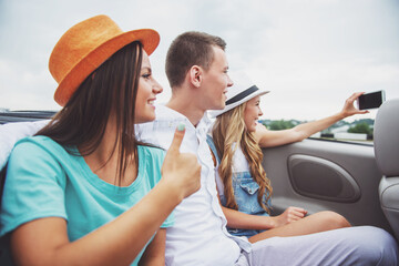 Friends in cabriolet