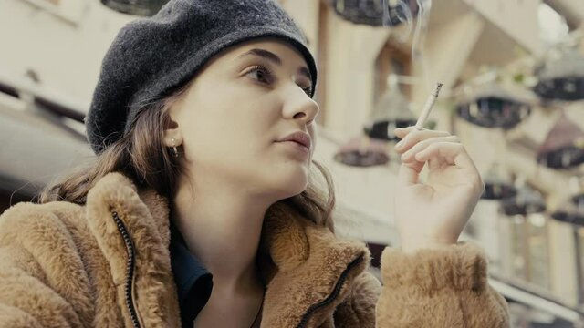 Young woman smoking a cigarette