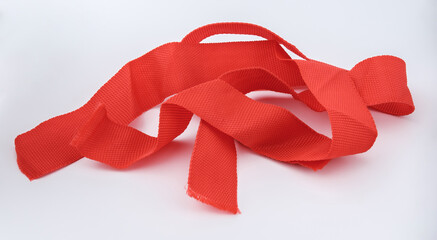 Red ribbons isolated on gray.