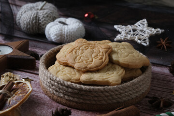 Christmas cookies tiger's head on a wooden background with decor