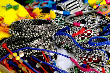 Fototapeta premium Indian Traditional jewellery displayed in a street shop for sale in Pune, Maharashtra. Indian art, Indian Traditional jewelry.