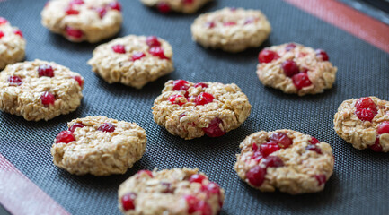 The process of making dietary oatmeal cookies with banana and cranberries. Vegan food