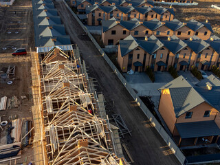 Fototapeta premium Roof under constructions with lots of tile and red brick chimney