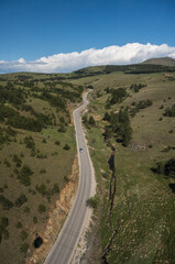 A photo of the mountain road taken from a gondola. Top view of mountain road.