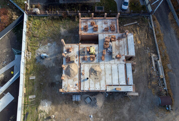 einforced concrete house foundation, poured concrete floor and brick walls.