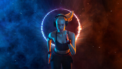 Sprinter run. Strong athletic woman running on black background with neon lights wearing in the...