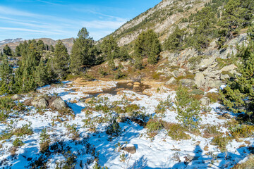 litthe path in snowy mountains of the Pyrenees, in the Aran valley Lleida Catalonia Spain