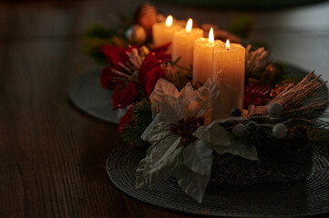 a few festive candles are lit on the coffee table