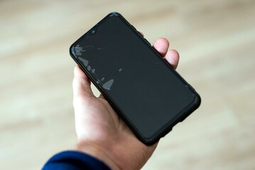 Damagen screen on black smartphone