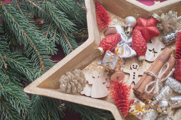 decorating a small gift on the tree,  German Christmas pastries, chocolate gingerbread and star-shaped cookies with white icing