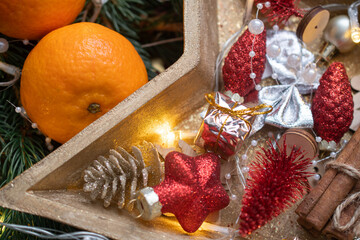 Tangerines and German Christmas pastries, chocolate gingerbread and star-shaped cookies with white icing