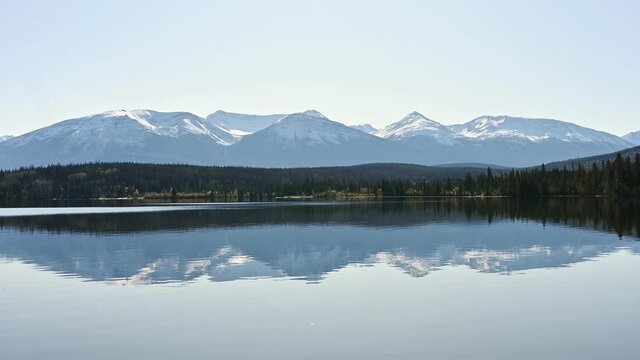 Canadian Rockies with pine forest reflection on Pyramid Lake at Jasper national park