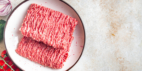 ground meat fresh minced meat pork, beef, lamb cutlets or meatballs healthy meal food diet snack on...